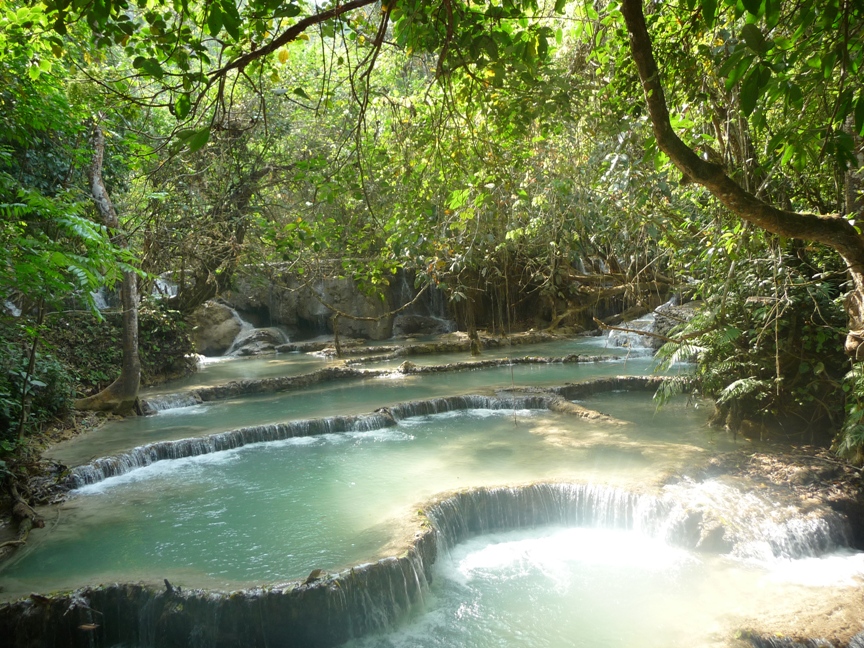 Kuang Si flows over limestone resulting in these travertinous rock formations...