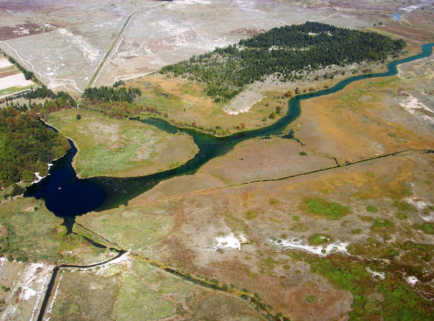 Aerial view of the Media Luna syatem with the main pool to the left and natural channel extending to the right.